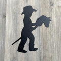 Kid Riding Toy Horse Metal Sign Cutout - Child's Cowboy Adventure: Kid Riding Toy Horse Metal Wall Art Sign
