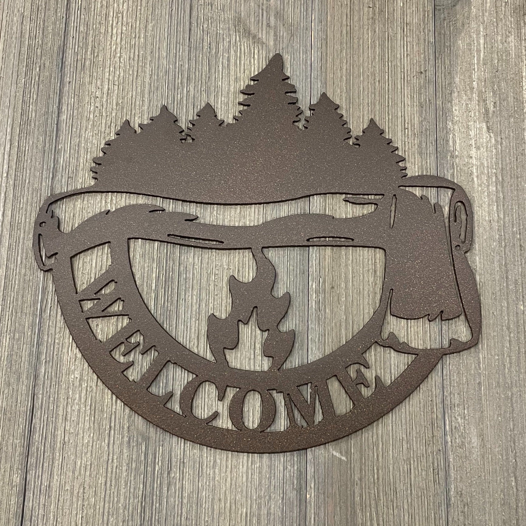 Welcome to the Woods Metal Sign: Axe, Campfire and Tree Silhouette