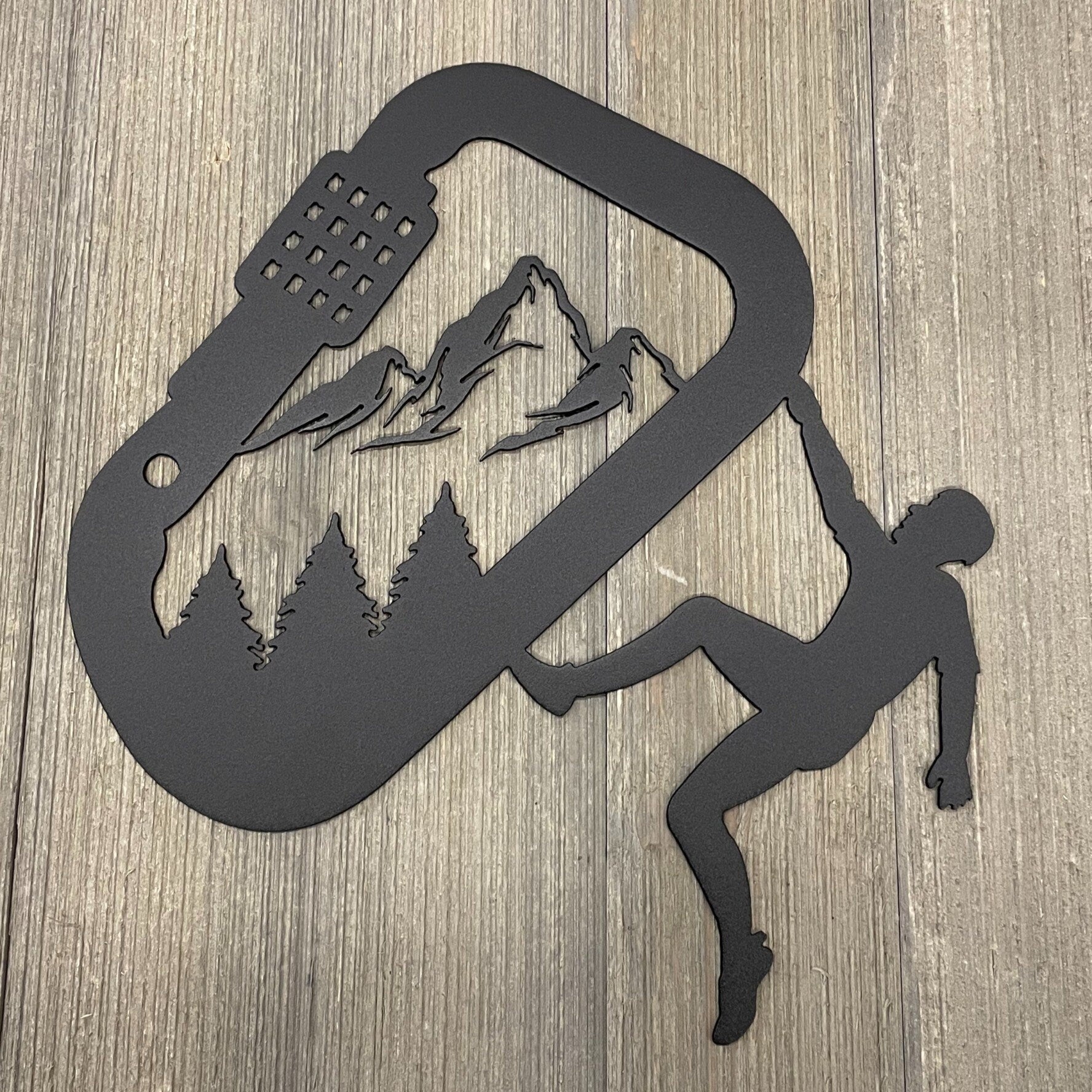Summit Ascent: Inspiring Metal Sign with Climber and Mountain Carabiner Scene
