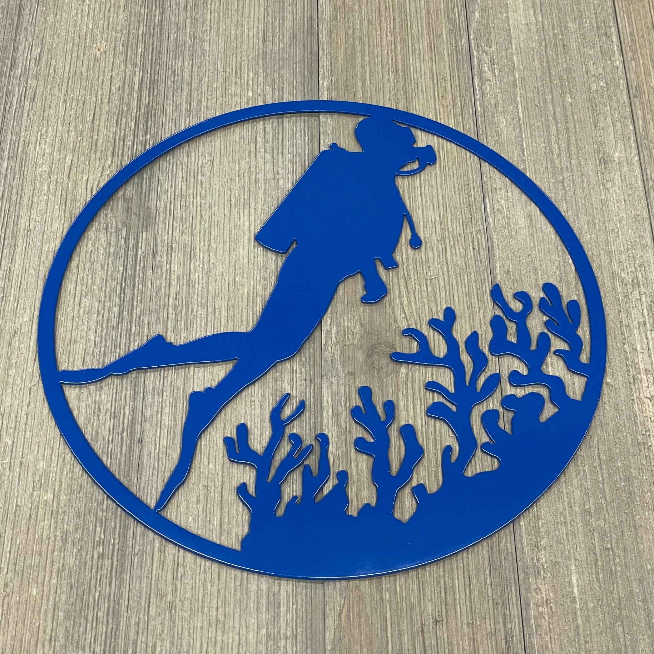 Deep Blue Serenity: Metal Sign featuring Scuba Diver Amidst Vibrant Coral Reef