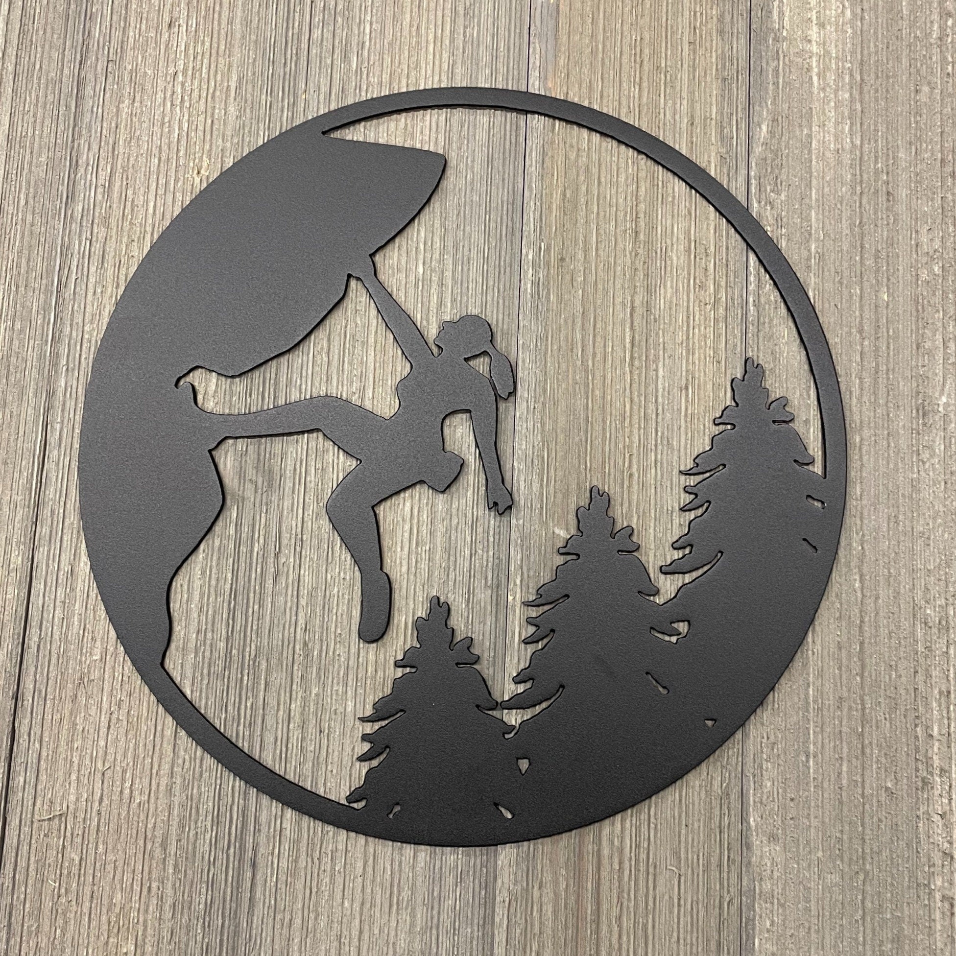 Metal Woman Rock Climbing Scene with Nature Backdrop