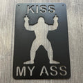 Bigfoot Flipping the Bird Metal Sign - Humorous "Kiss My Ass" Wall Decor