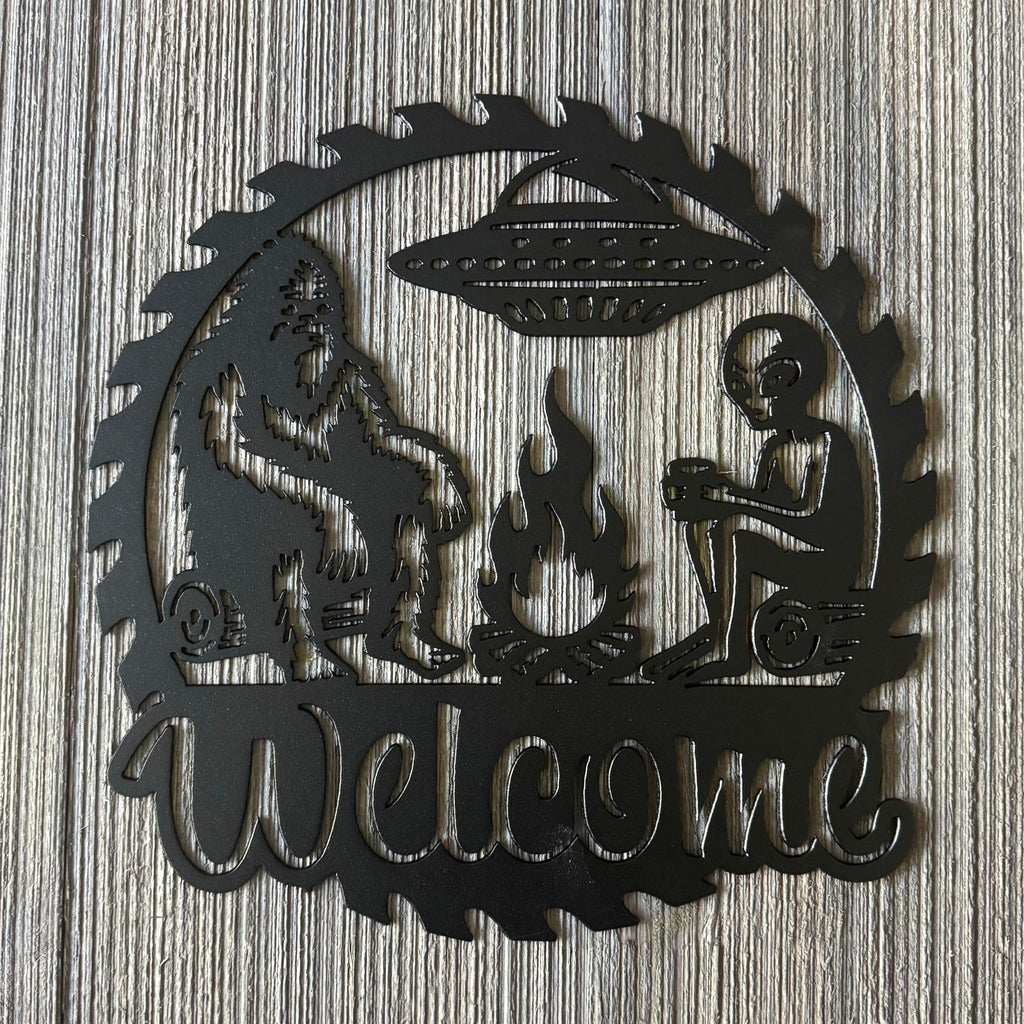 Bigfoot and Alien Campfire Metal Sign - UFO and Wilderness Wall Art - Welcome Sign - Gift for Conspiracy Theorist - Humorous Decor