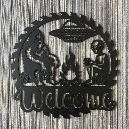 Bigfoot and Alien Campfire Metal Sign - UFO and Wilderness Wall Art - Welcome Sign - Gift for Conspiracy Theorist - Humorous Decor