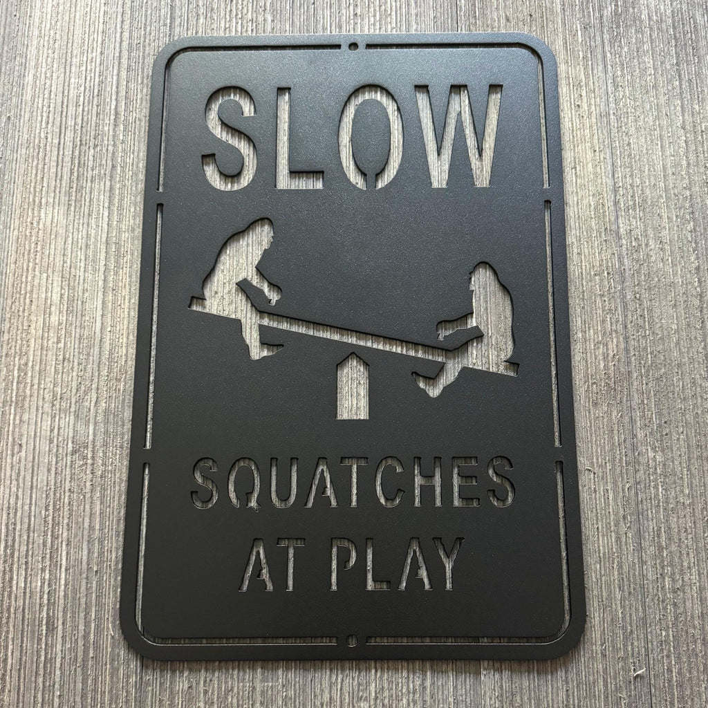 Slow Squatches at Play Metal Sign - Bigfoots on Teeter Totter Design